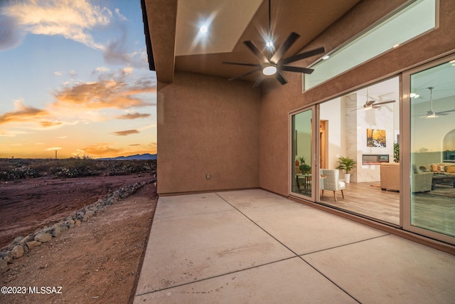 view of patio / terrace featuring ceiling fan