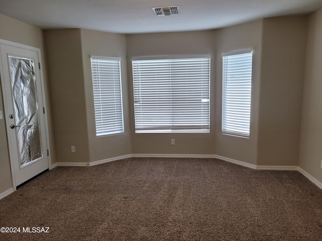 interior space with visible vents and baseboards