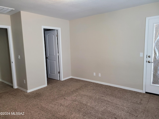 interior space featuring baseboards and carpet
