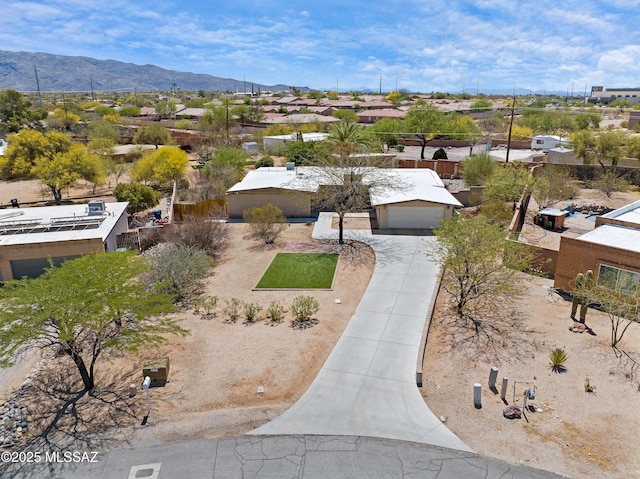aerial view of residential area with a mountain backdrop