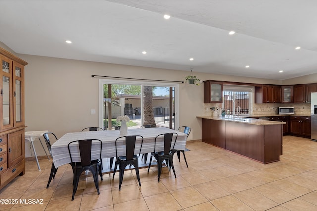 dining area with light tile patterned floors, recessed lighting, and baseboards