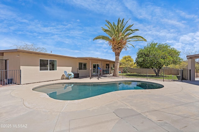 view of pool with fence and a patio area