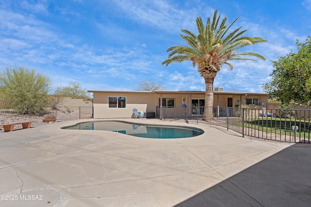 view of pool featuring fence and a patio
