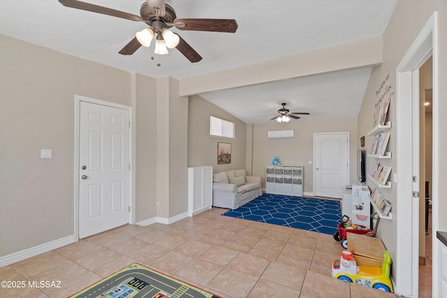 game room featuring ceiling fan, vaulted ceiling, tile patterned floors, and baseboards