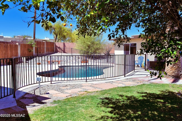 view of swimming pool with fence and a patio area