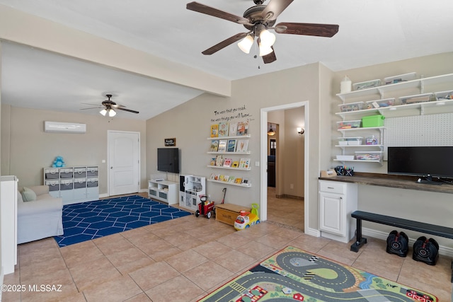 playroom with a ceiling fan, light tile patterned floors, a desk, a wall mounted air conditioner, and baseboards