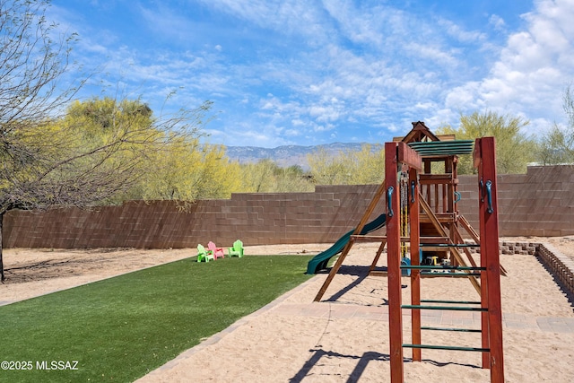 view of playground featuring a mountain view