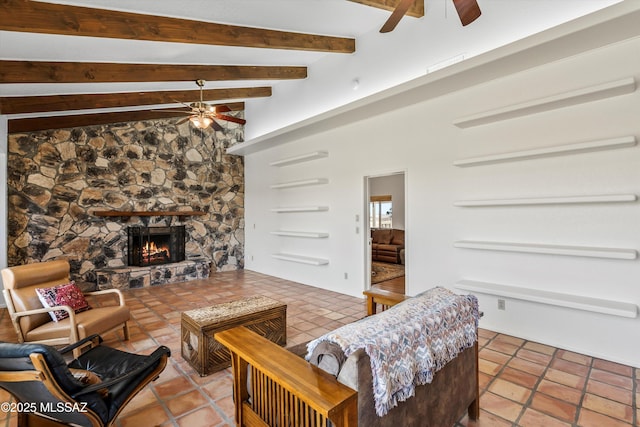 20 Buckskin Ln, Sonoita, AZ 85637 - tiled living room featuring vaulted ceiling with beams, ceiling fan, and a fireplace