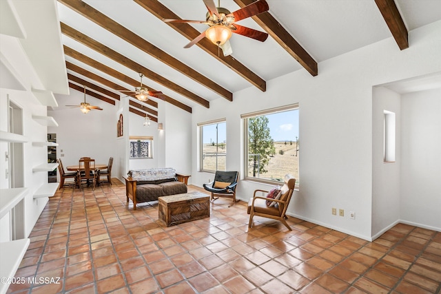 20 Buckskin Ln, Sonoita, AZ 85637 - living room featuring baseboards, a ceiling fan, and lofted ceiling with beams