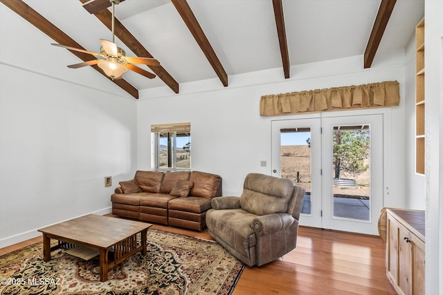 20 Buckskin Ln, Sonoita, AZ 85637 - living area with a ceiling fan, plenty of natural light, vaulted ceiling with beams, and light wood-type flooring