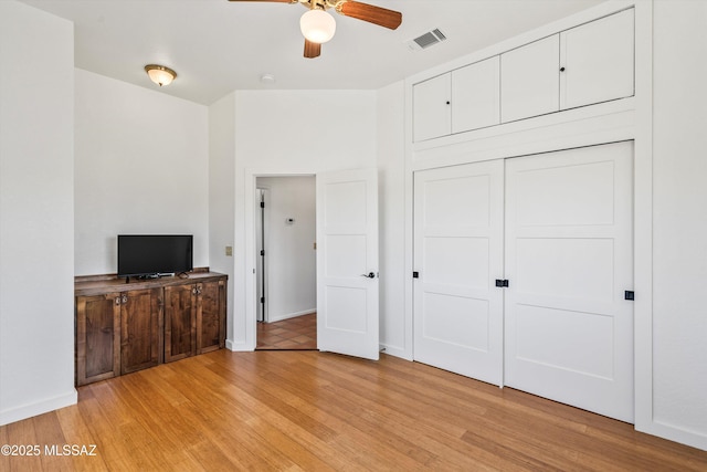 20 Buckskin Ln, Sonoita, AZ 85637 - unfurnished bedroom featuring light wood-style floors, baseboards, visible vents, and a closet