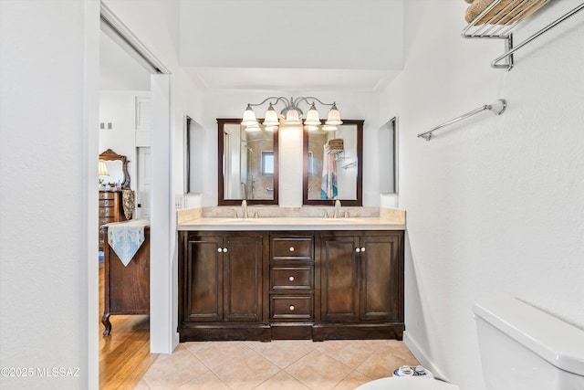 20 Buckskin Ln, Sonoita, AZ 85637 - bathroom with a sink, tile patterned flooring, toilet, and double vanity