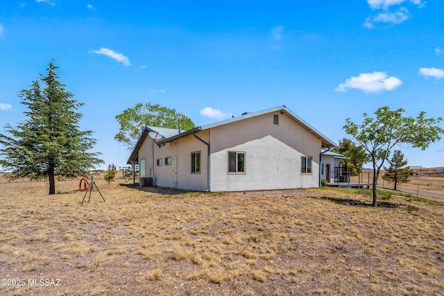 20 Buckskin Ln, Sonoita, AZ 85637 - view of side of property featuring fence, central AC unit, and stucco siding