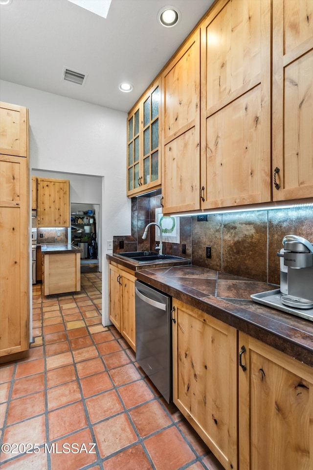 20 Buckskin Ln, Sonoita, AZ 85637 - kitchen featuring decorative backsplash, dishwasher, light brown cabinets, and dark countertops