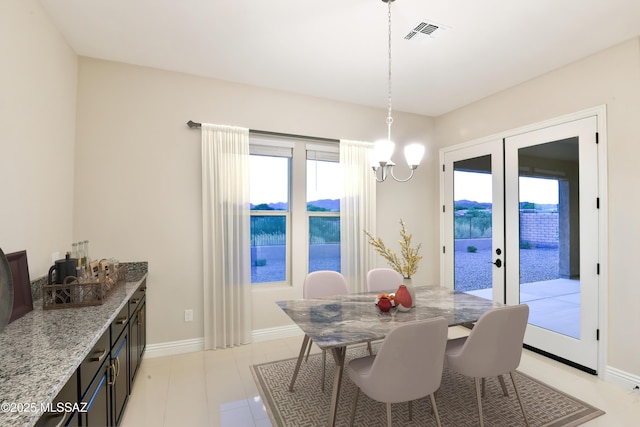 13711 N Hidden Springs Dr, Oro Valley, AZ 85755 - dining space with french doors and baseboards
