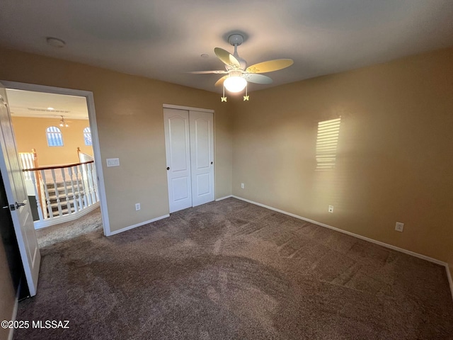 60954 Rock Ledge Loop, Tucson, AZ 85739 - unfurnished bedroom with carpet, baseboards, a closet, and ceiling fan
