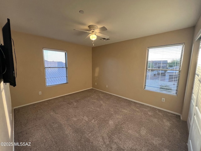 60954 Rock Ledge Loop, Tucson, AZ 85739 - spare room featuring ceiling fan, carpet flooring, and baseboards