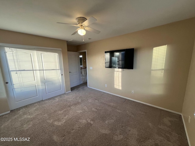 60954 Rock Ledge Loop, Tucson, AZ 85739 - unfurnished bedroom with carpet, baseboards, and ceiling fan