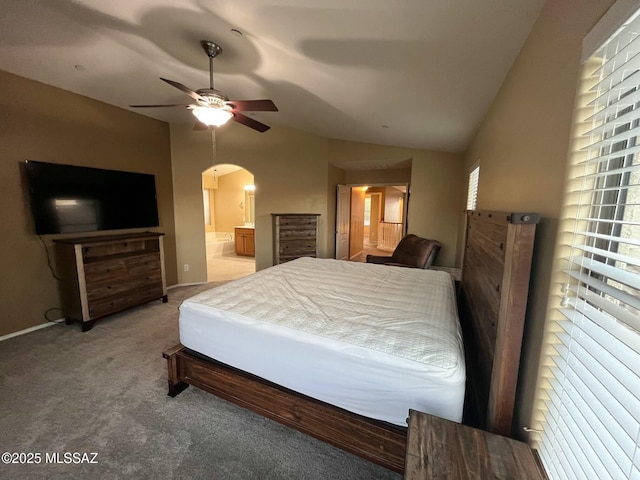 60954 Rock Ledge Loop, Tucson, AZ 85739 - carpeted bedroom featuring lofted ceiling, arched walkways, ensuite bath, and ceiling fan