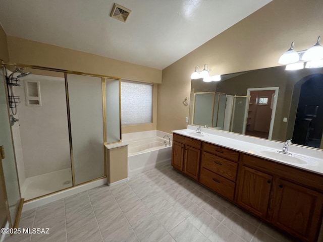 60954 Rock Ledge Loop, Tucson, AZ 85739 - full bathroom featuring lofted ceiling, a stall shower, a bath, double vanity, and tile patterned floors