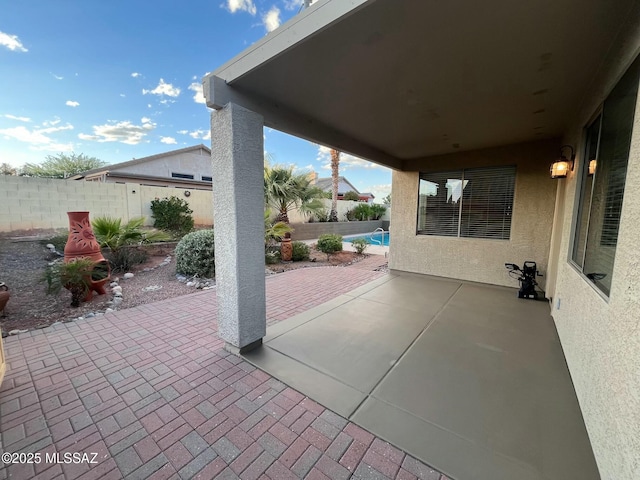 60954 Rock Ledge Loop, Tucson, AZ 85739 - view of patio / terrace featuring a fenced backyard