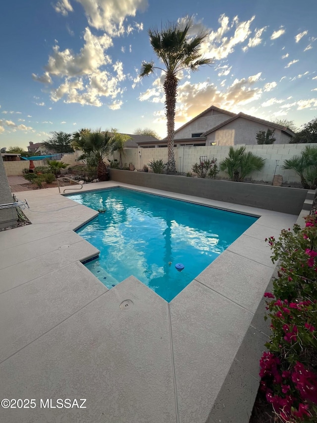 60954 Rock Ledge Loop, Tucson, AZ 85739 - view of swimming pool with a fenced backyard and a patio