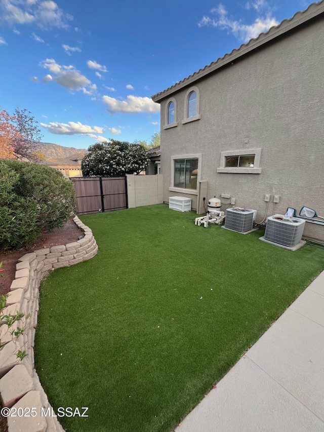 60954 Rock Ledge Loop, Tucson, AZ 85739 - view of yard featuring central AC