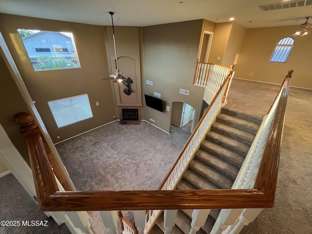 60954 Rock Ledge Loop, Tucson, AZ 85739 - stairs featuring carpet flooring, ceiling fan, and baseboards
