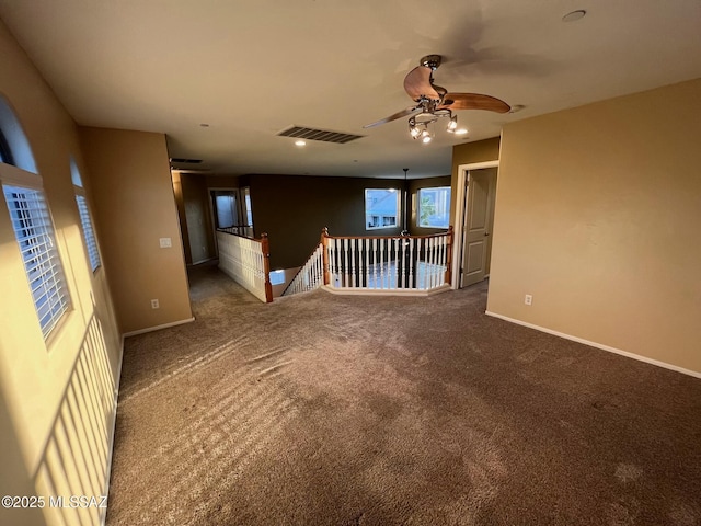 60954 Rock Ledge Loop, Tucson, AZ 85739 - spare room with ceiling fan, carpet flooring, and baseboards