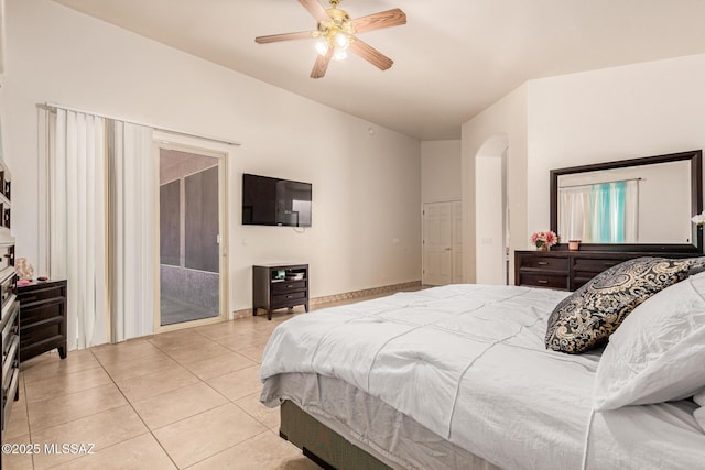 bedroom featuring ceiling fan, light tile patterned floors, and access to exterior