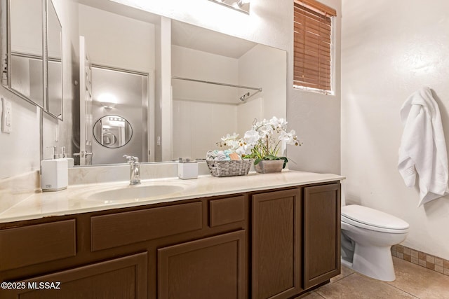 full bath with tile patterned flooring, toilet, vanity, and a shower
