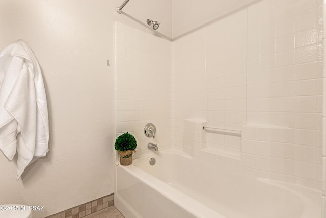 full bath with shower / bath combination and baseboards