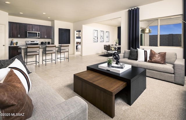 living area with recessed lighting, light tile patterned floors, and light carpet