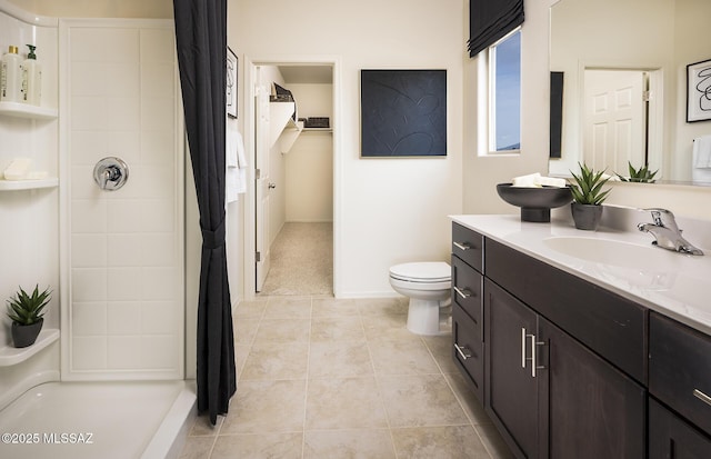 full bath featuring vanity, tile patterned floors, toilet, and curtained shower