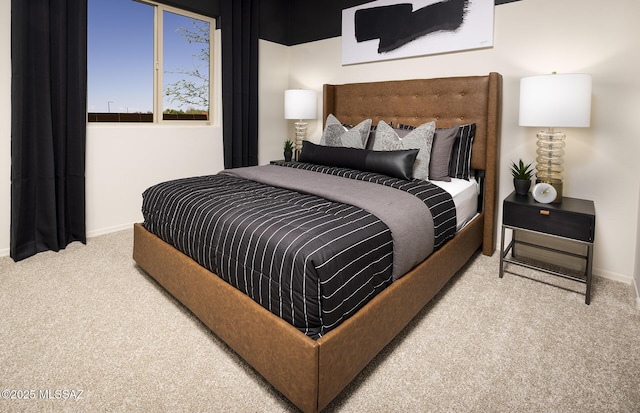 carpeted bedroom with baseboards