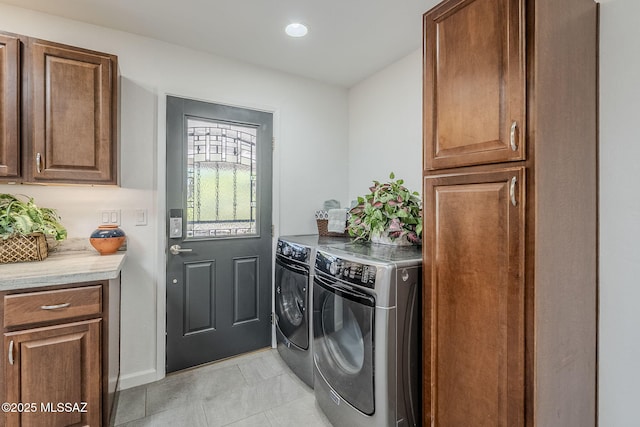 4825 E Hawthorne St, Tucson, AZ 85711 - laundry area with washer and dryer, cabinet space, light tile patterned floors, and recessed lighting
