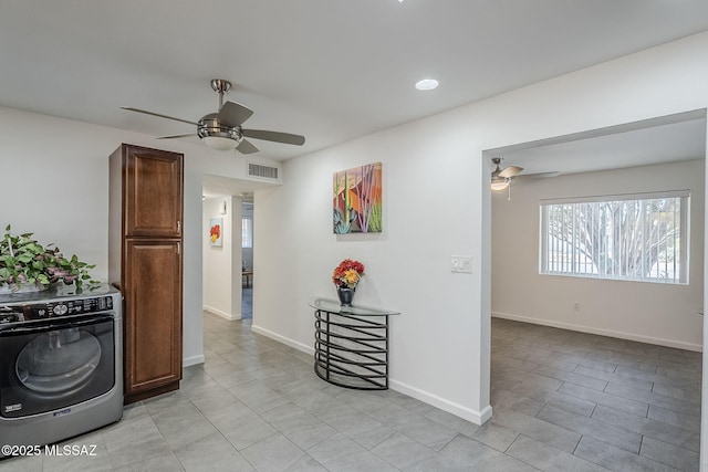 4825 E Hawthorne St, Tucson, AZ 85711 - interior space featuring washer / dryer, light tile patterned floors, and recessed lighting