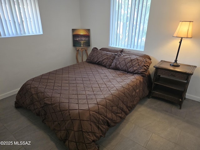 4825 E Hawthorne St, Tucson, AZ 85711 - bedroom featuring tile patterned floors and baseboards