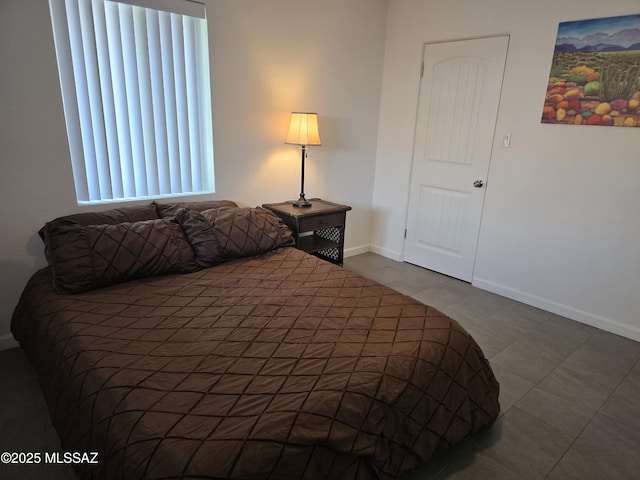 4825 E Hawthorne St, Tucson, AZ 85711 - tiled bedroom with baseboards