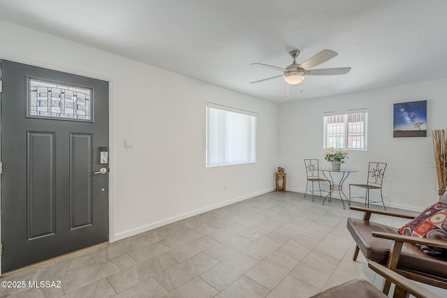 4825 E Hawthorne St, Tucson, AZ 85711 - foyer with a ceiling fan and baseboards