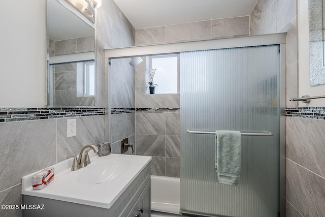 4825 E Hawthorne St, Tucson, AZ 85711 - bathroom with tile walls, vanity, and enclosed tub / shower combo