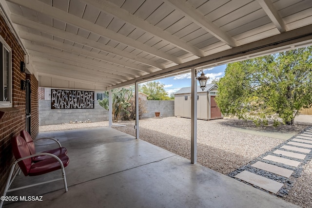 4825 E Hawthorne St, Tucson, AZ 85711 - fenced backyard featuring a storage shed and a patio