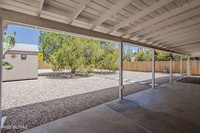 4825 E Hawthorne St, Tucson, AZ 85711 - fenced backyard featuring a patio area and a shed