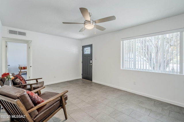 4825 E Hawthorne St, Tucson, AZ 85711 - living area featuring plenty of natural light, ceiling fan, and light tile patterned floors