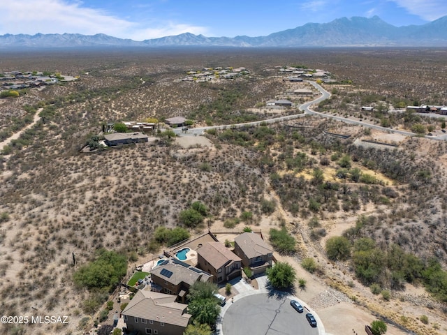 birds eye view of property featuring a rural view, a mountain view, and a desert view