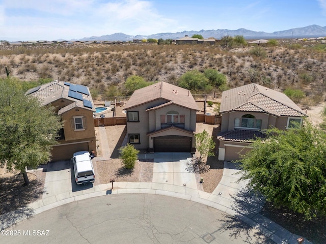 drone / aerial view featuring a desert view, a mountain view, and a rural view