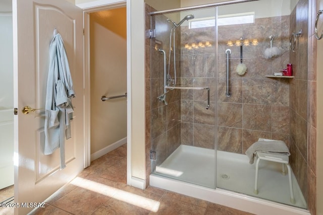 61867 E Ironwood Ln, Tucson, AZ 85739 - bathroom with tile patterned flooring and a stall shower
