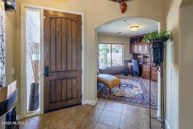 61867 E Ironwood Ln, Tucson, AZ 85739 - entryway with arched walkways, tile patterned floors, visible vents, and baseboards