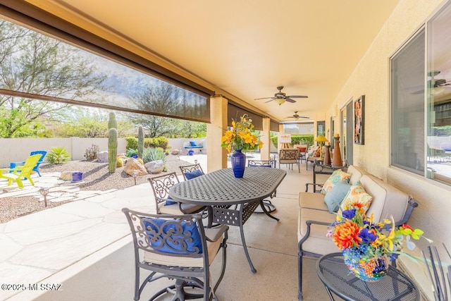 61867 E Ironwood Ln, Tucson, AZ 85739 - view of patio / terrace with outdoor dining area, a fenced backyard, and ceiling fan