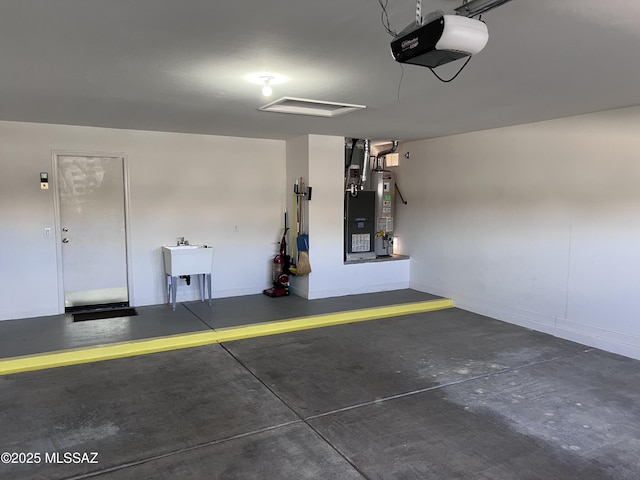 61867 E Ironwood Ln, Tucson, AZ 85739 - garage with a sink, a garage door opener, and gas water heater
